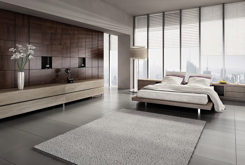 A modern bedroom with a bed and a dresser.
