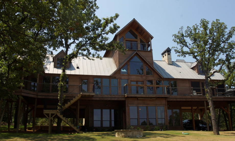 Multi-level elevated wooden house among trees