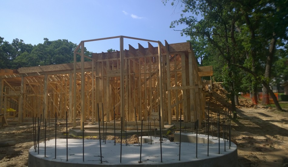 A house under construction with wooden framing.