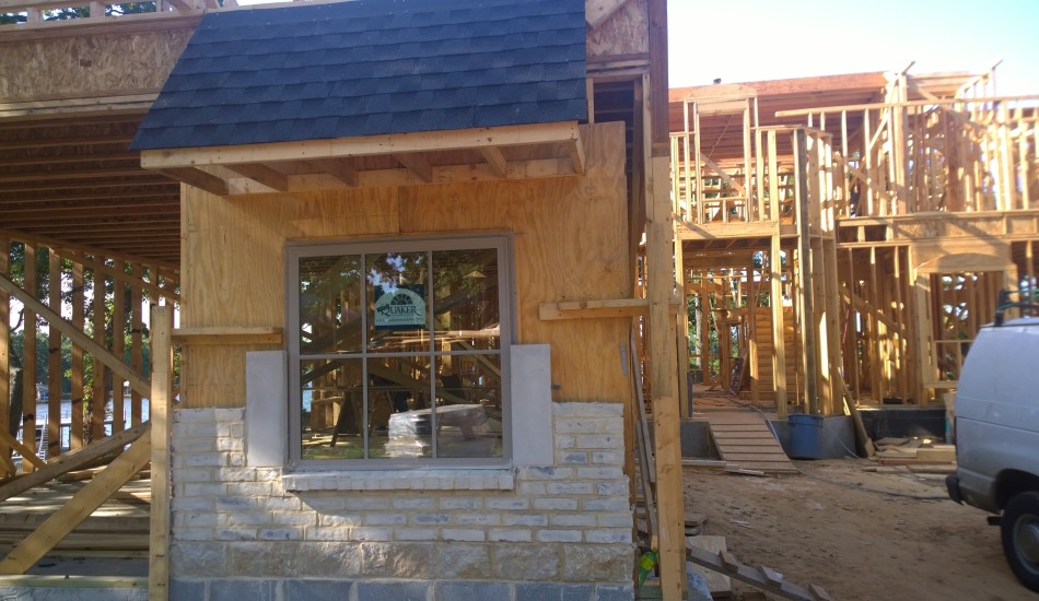 House under construction with window and framing