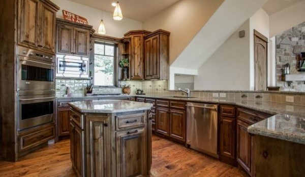 Rustic kitchen with wooden cabinets and island