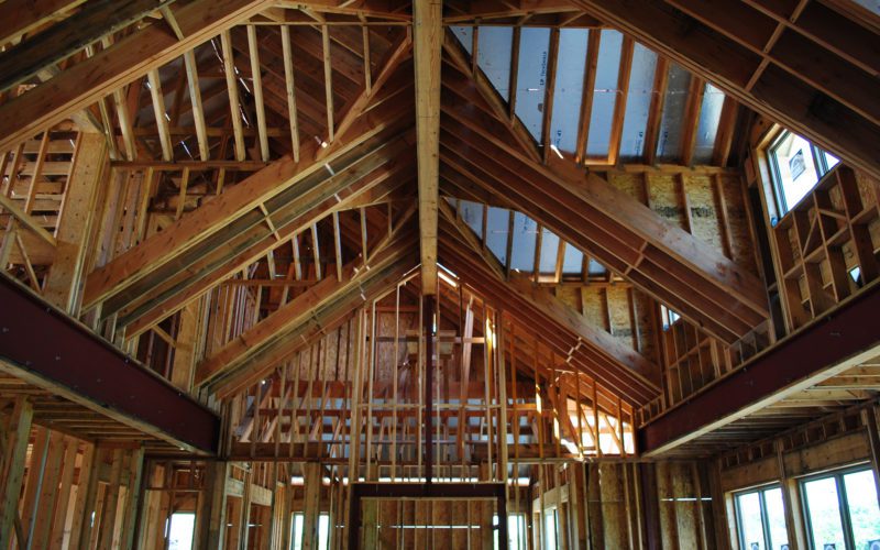 The inside of a house being built with wood framing.