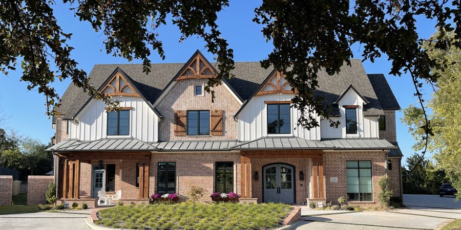 Front view of a luxury house with small garden