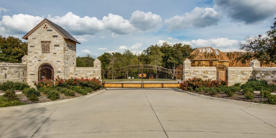 Stone estate entrance with wrought-iron gate